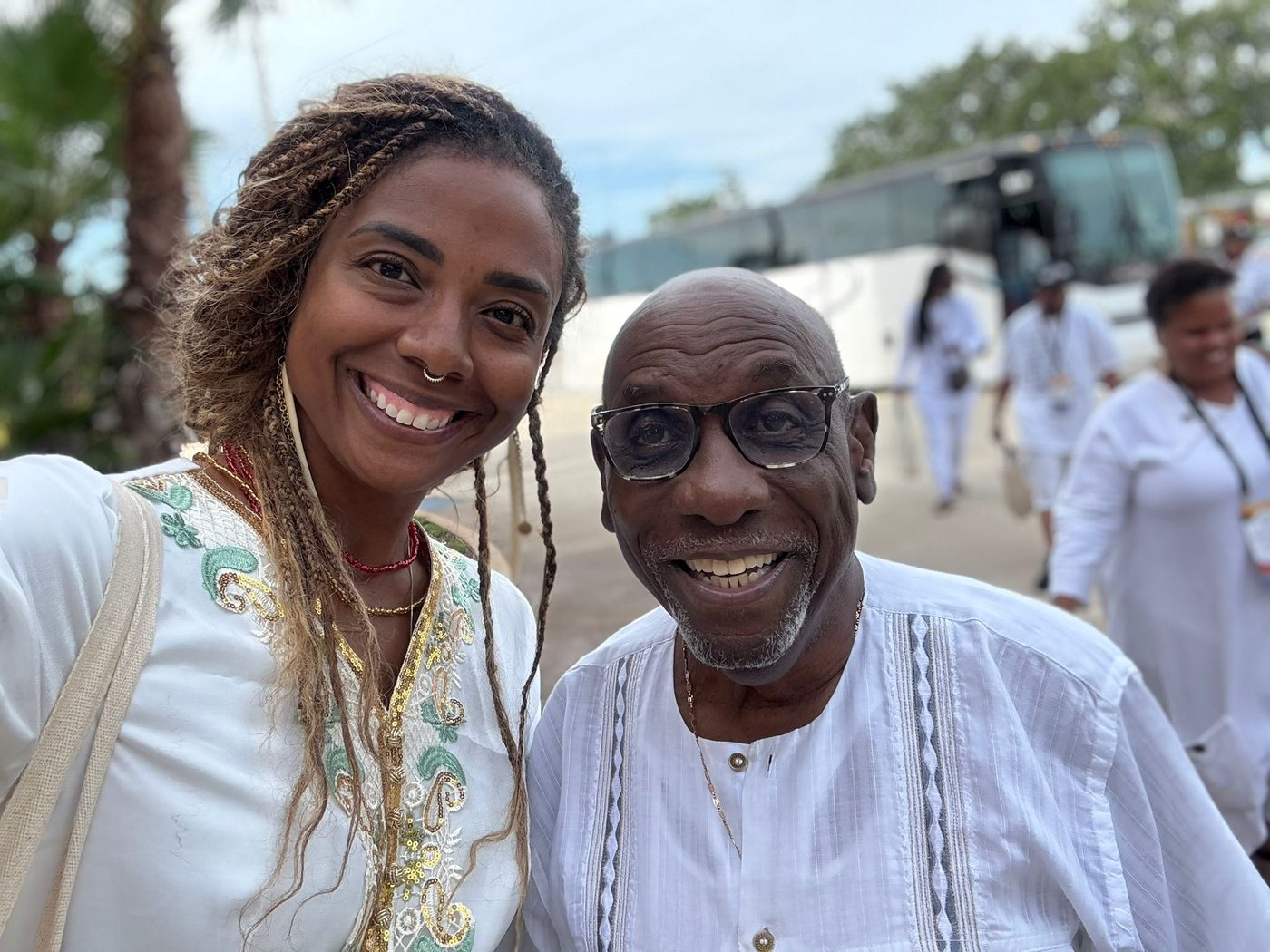 Two smiling MAABPsi members dressed in white outside the ABPsi International Convention