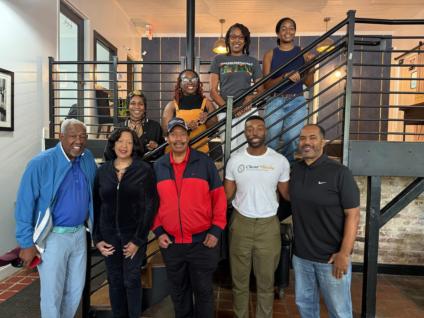 MAABPsi members and students gathered on a staircase at an in-person chapter meeting